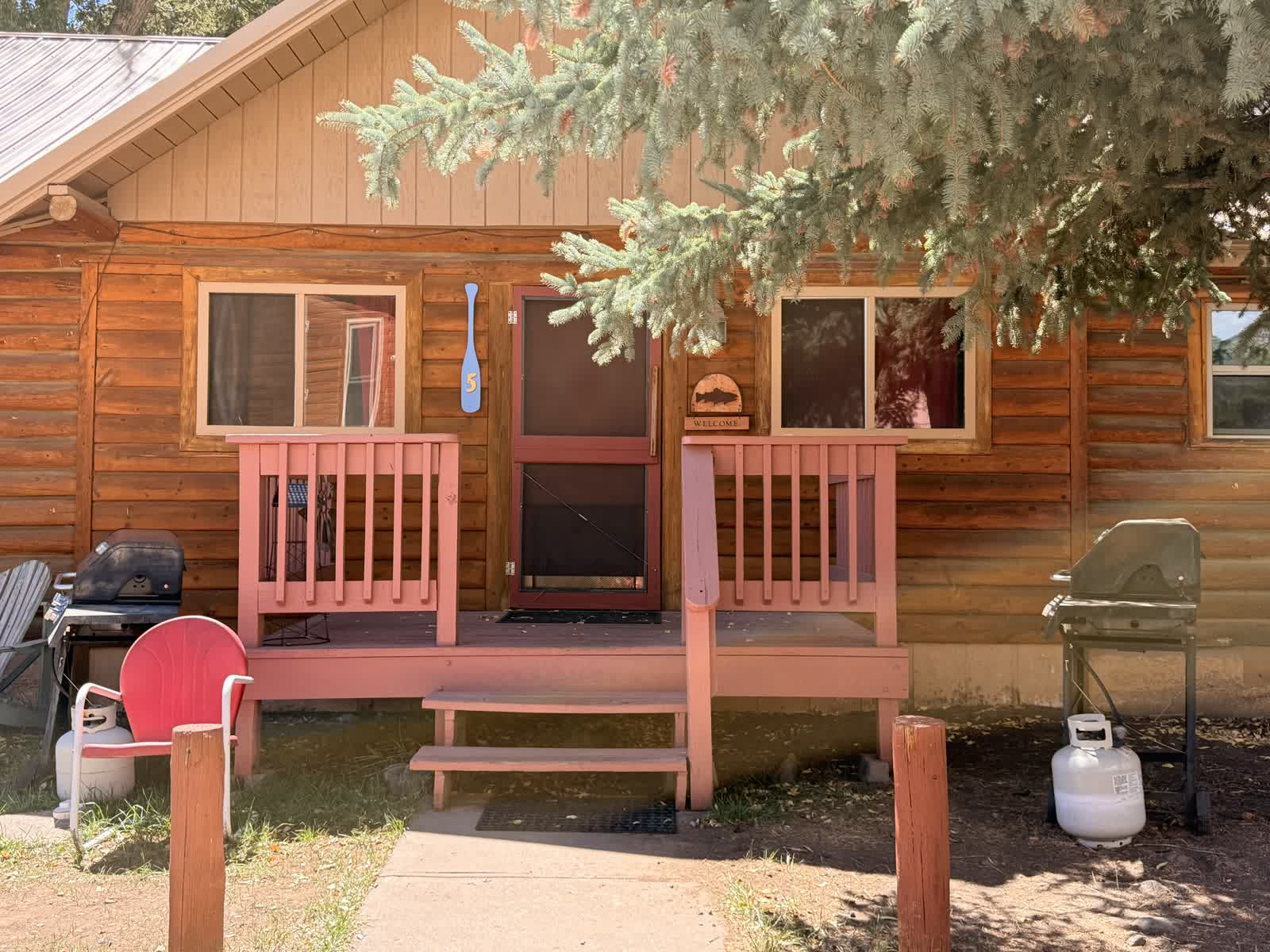Cabin porch with wooden railings