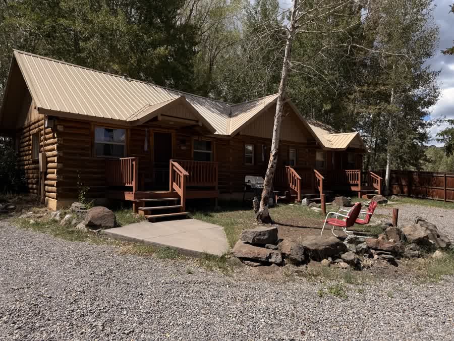 Cabins gathered around a stone fire pit