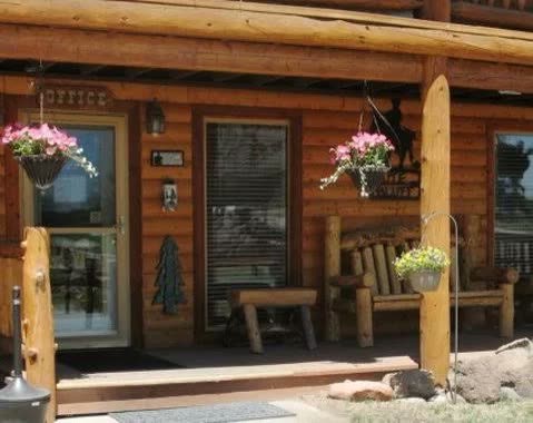 The lodge office porch with hanging flower baskets