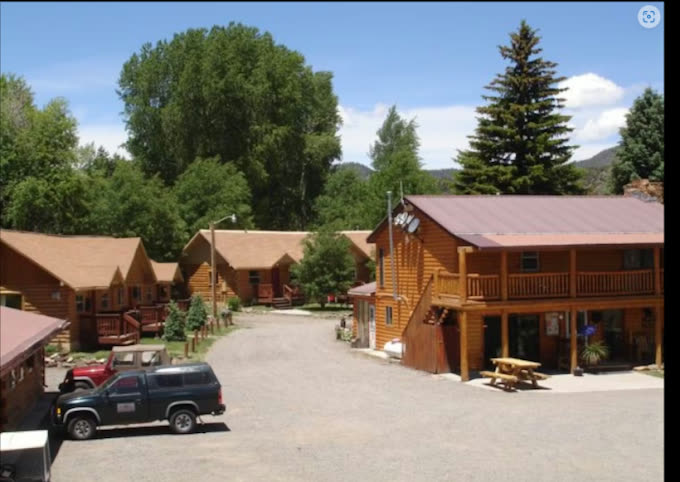 The lodge building and cabins from the main drive