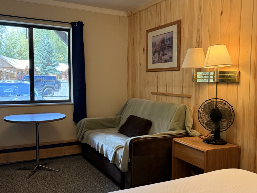 Compact lodge room with a bed and a window
