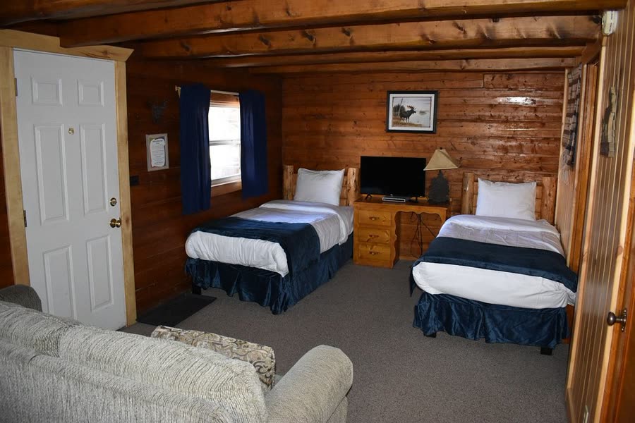Log-walled room with two twin beds