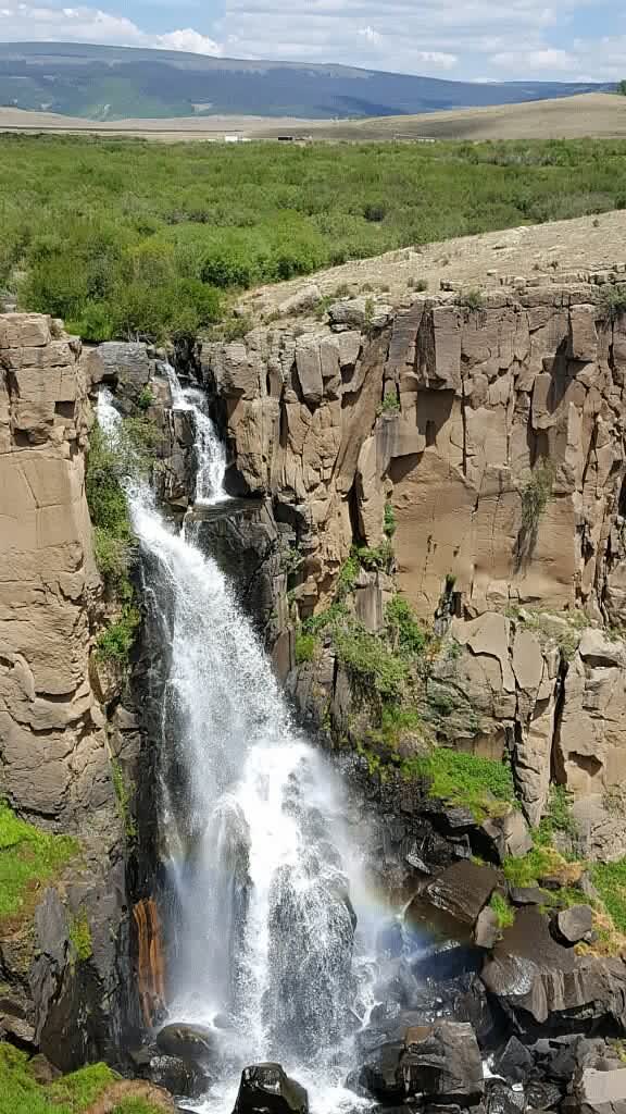 A waterfall tumbling through a rock gorge